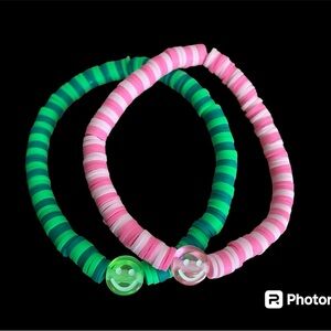 (2) handmade smiley face brackets